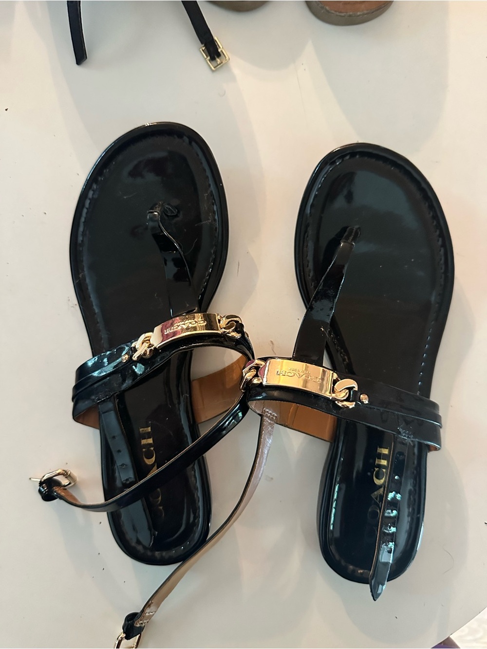 Coach Black Designer Sandals with Leather Straps and Gold Logo